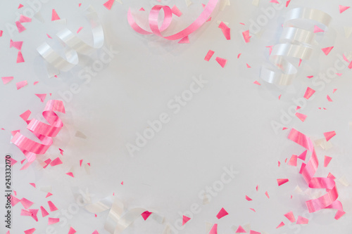 close up on group of white and pink rolling ribbon and confetti on white background with copy space for valentine's day  festival happy new year ,carnival , birthday and anniversary, concept design	