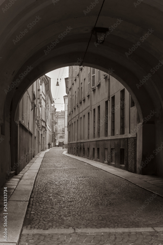 Parma, Italy. Street view through the arch in the Old town. (tone effect)