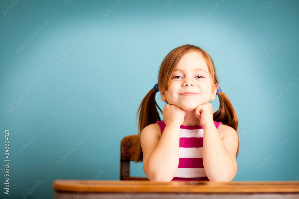 Happy Little Girl Sitting in School Desk - Room for Text Stock Photo ...