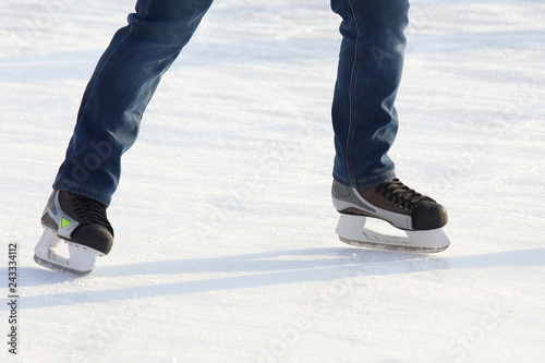 people skating on the ice rink