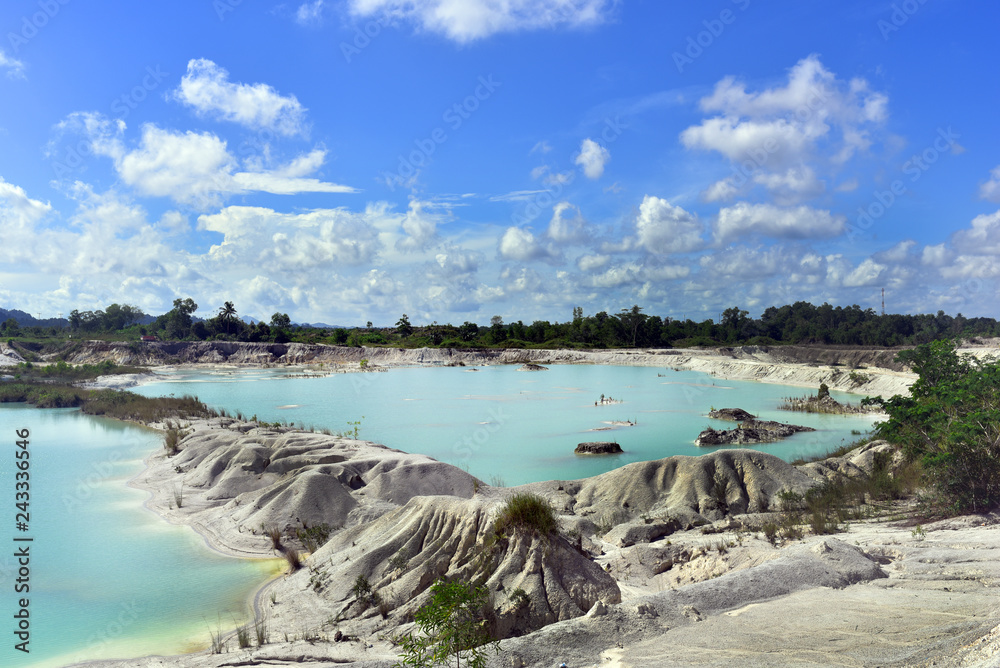 Clear blue Danau Kaolin Lake, Belitung Island in Air Raya Village, Indonesia