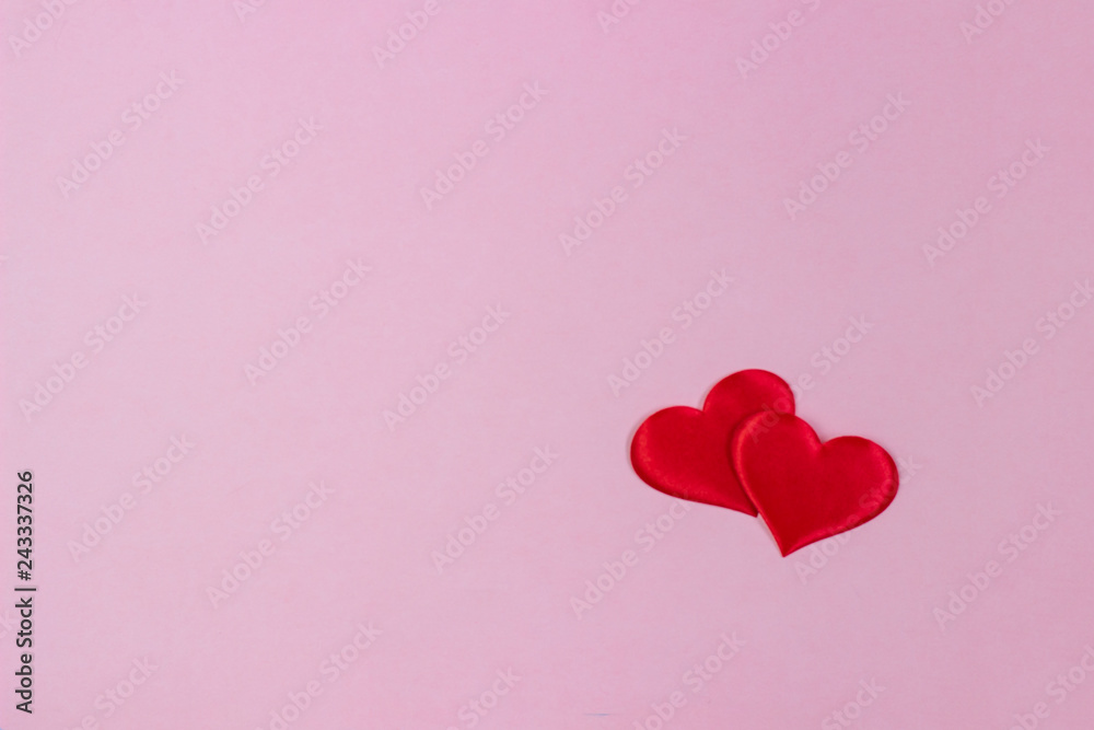 Valentine's Day, two red hearts on a pink background Valentine's Day, two red hearts on a pink background