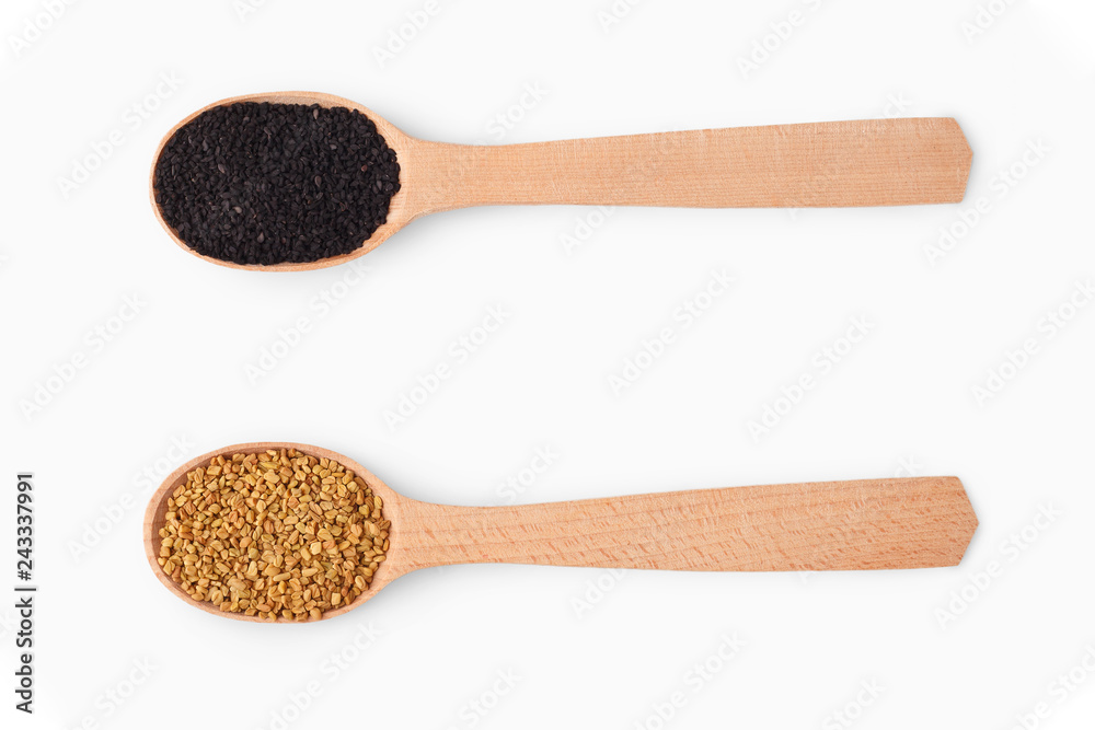 Wooden spoons with aromatic culinary condiments on white Wooden spoons with aromatic culinary condiments on white