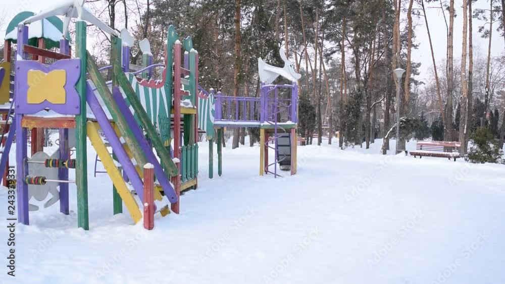 View of the Playground in the winter Park of the city. View of the Playground in the winter Park of the city.