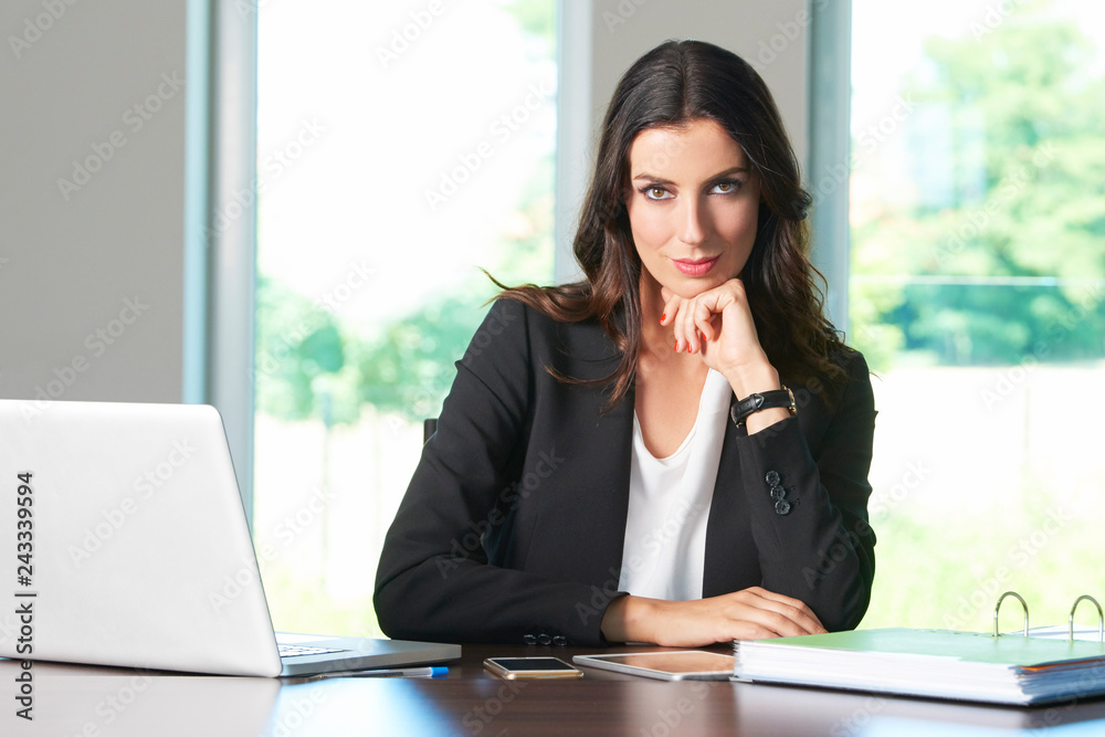 Thinking young businesswoman in the office Thinking young businesswoman in the office