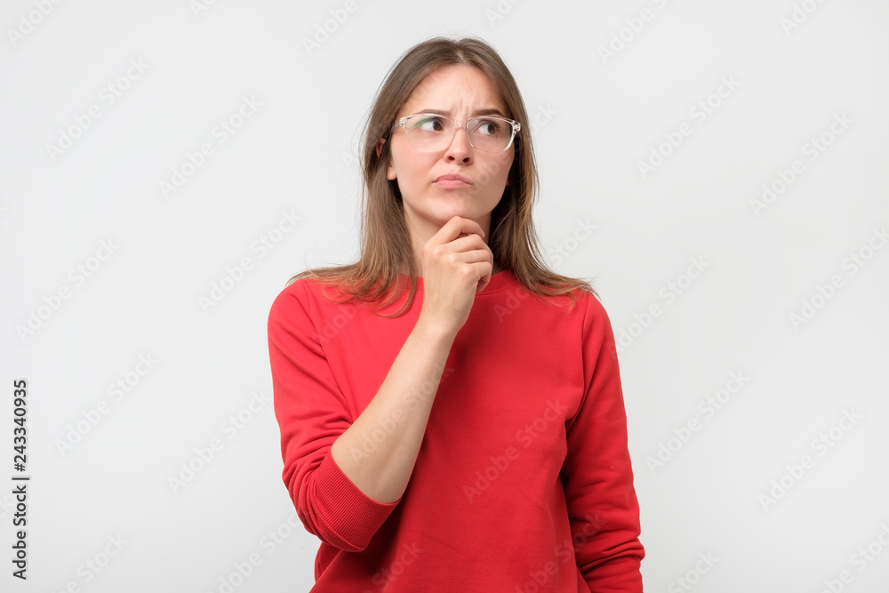Doubtful woman looking with disbelief expression aside. Doubtful woman looking with disbelief expression aside.