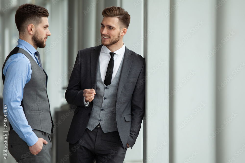 Two business colleagues at meeting in modern office interior. Two business colleagues at meeting in modern office interior.