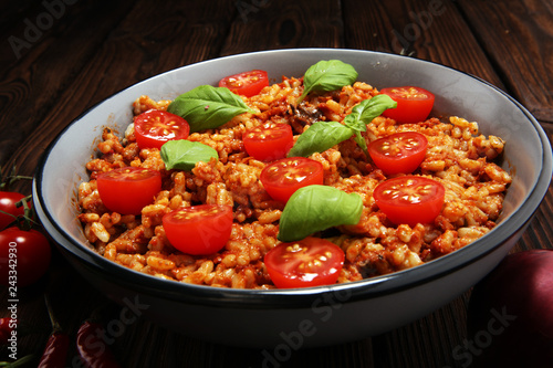 risotto with tomatoes, fresh herbs and parmesan cheese.