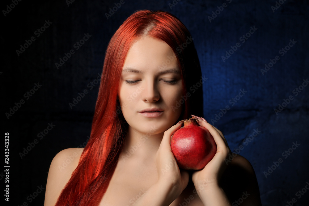 portrait of beautiful girl with red hair and pomegranate fruit on the background of blue wall. different poses. portrait of beautiful girl with red hair and pomegranate fruit on the background of blue wall. different poses.