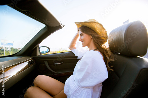 Young attractive woman driv...