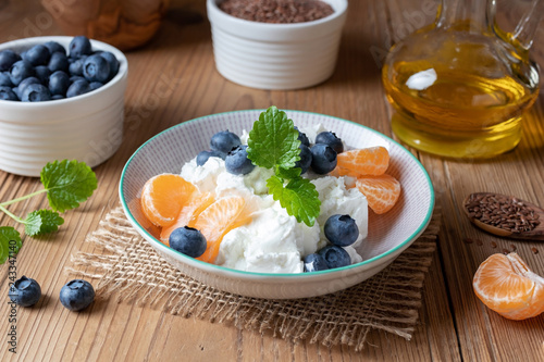 Cottage cheese with fresh fruit and flax seed oil photo