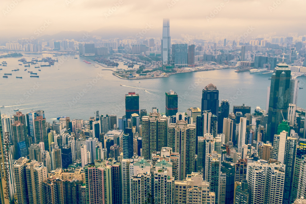 Fototapeta premium Modern City and Business with foggy weather from Victoria Peak, Hong Kong.
