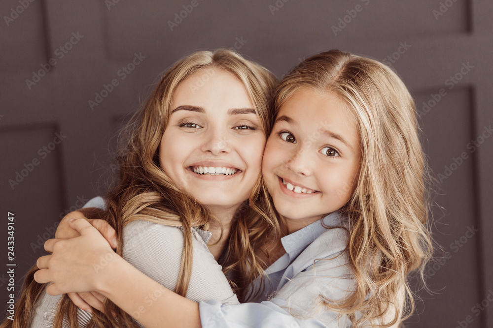 Spending spare time together. Mum and little daughter cuddling Spending spare time together. Mum and little daughter cuddling
