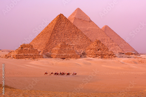 the great pyramids of giza in egypt with camel caravane