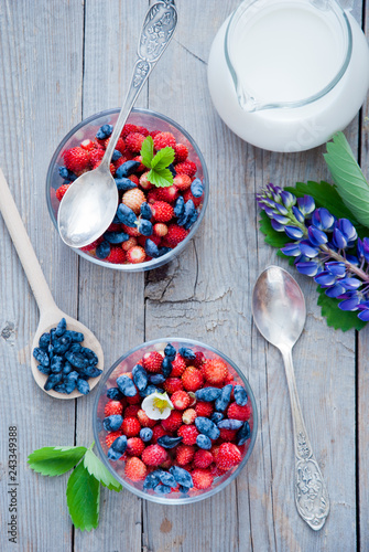 Breakfast with wild strawberries, Blue Honeysuckle Berries and milk