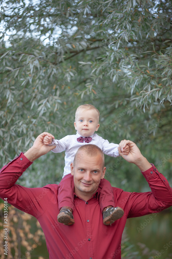Fototapeta premium Father playing with little son on nature. Happy family concept