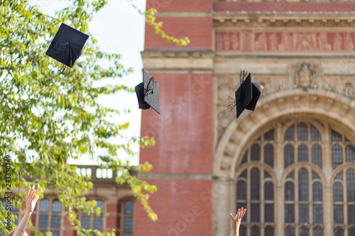 Graduates throwing hats in the air