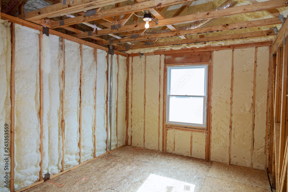 Insulation of attic with fiberglass cold barrier and insulation material Insulation of attic with fiberglass cold barrier and insulation material