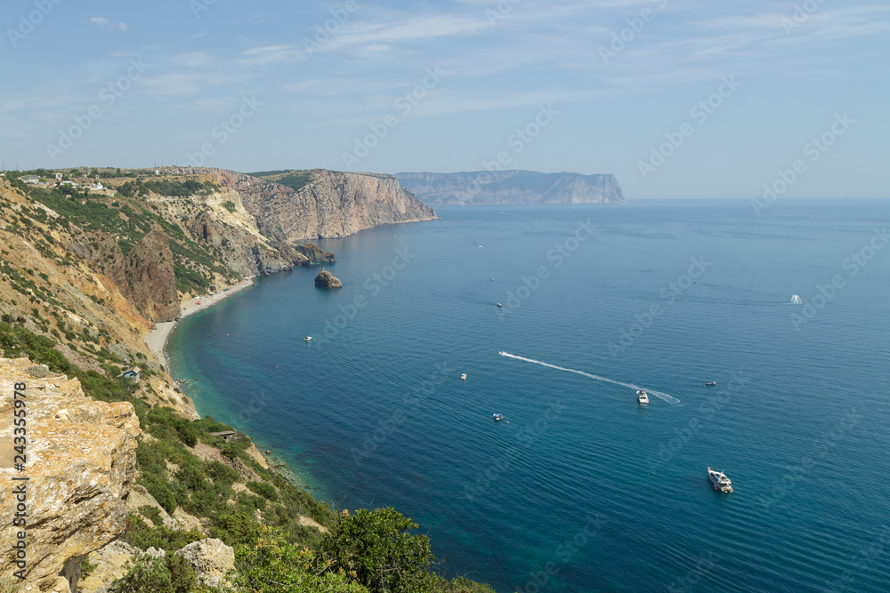 View from the cliffs on the sea, in which yachts float.