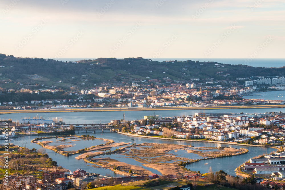 Look at Bidasoa-Txingudi bay with the three cities that formed it: Irun, Hondarribia and Hendaia, at the Basque Country.