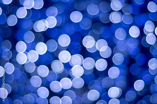 Background from blurred circles. Blue bokeh.