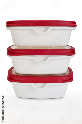 Billede på lærred three piles tupperwares on an isolated background
