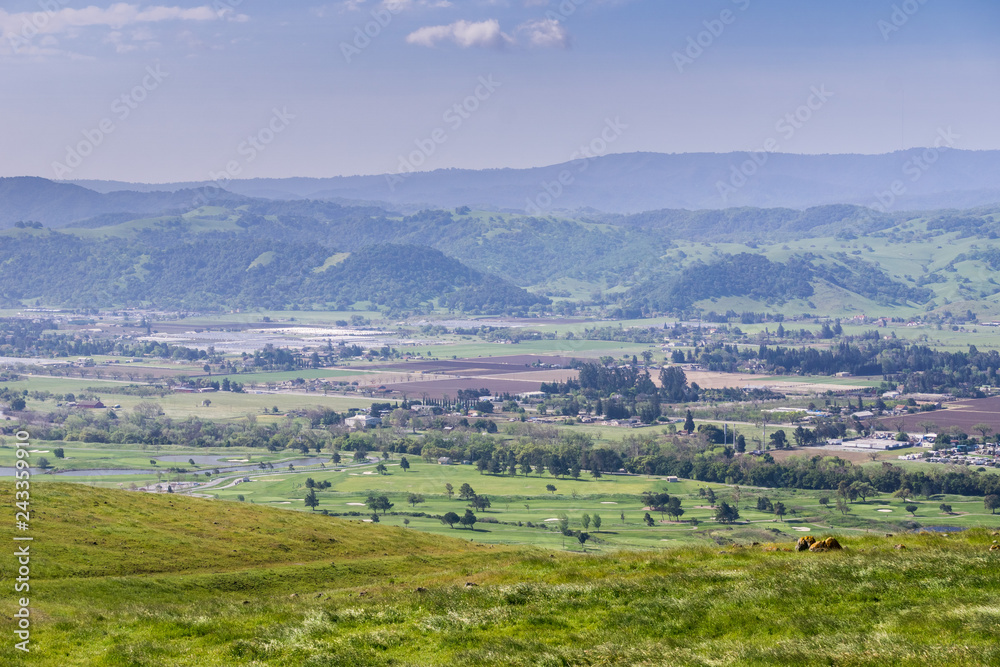 Fototapeta premium Aerial view of agricultural fields, mountain background, south San Francisco bay, San Jose, California