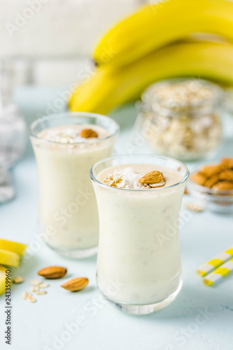 Vanilla cinnamon almond smoothie with coconut flakes. Selective focus, space for text.