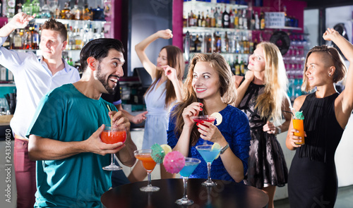 Students dancing on party in club