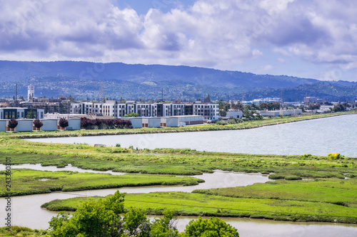 New apartment buildings under construction on the shoreline of San Francisco bay as seen from Bedwell Bayfront Park, Menlo Park, Silicon Valley, California