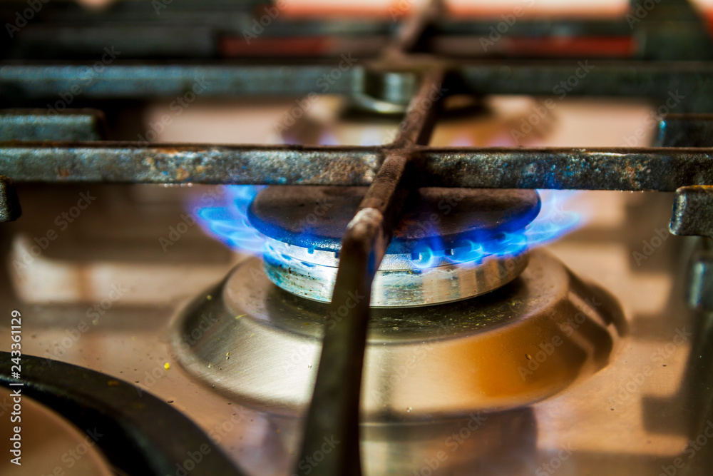 Gas stove burning and heating an cast iron pan Gas stove burning and heating an cast iron pan