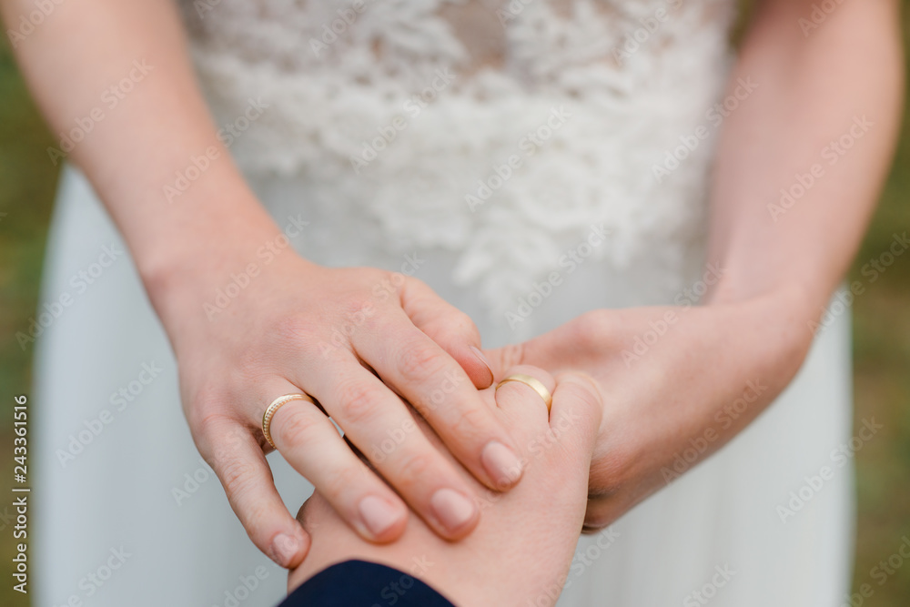 hands of bride and groom and wedding rings hands of bride and groom and wedding rings