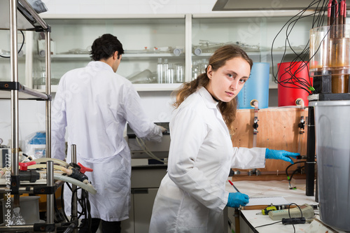 Female scientist using lab equipment