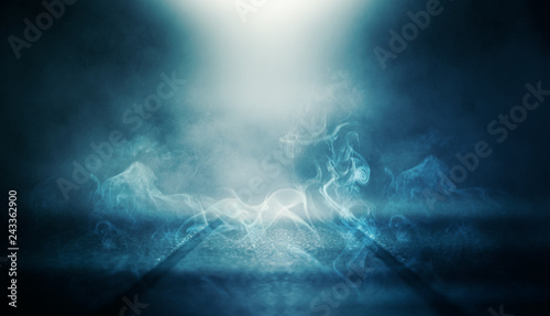 Background of empty dark room with rays of light. Concrete floor with light reflection. Smoke, neon blue light