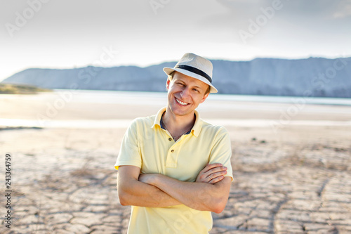 Portrait Of Young Handsome Man with white hat Smiling Outdoor