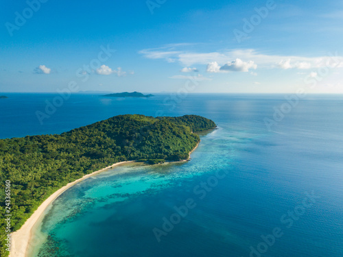 Aerial view of tropical  beach on island Ditaytayan. Beautiful tropical island with white sandy beach, palm trees and green hills. Travel tropical concept. Palawan, Philippines © umike_foto