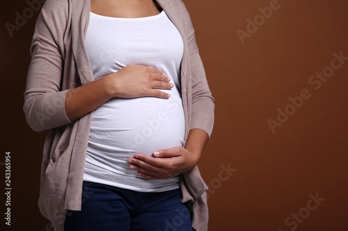 Portrait of a beautiful happy commercial pregnant woman © Djomas