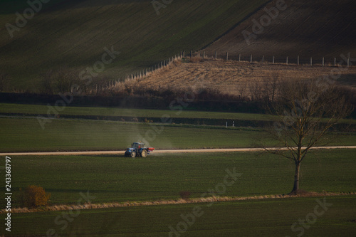 tractors sowing and working fields in the province of alava (the Basque country) photo