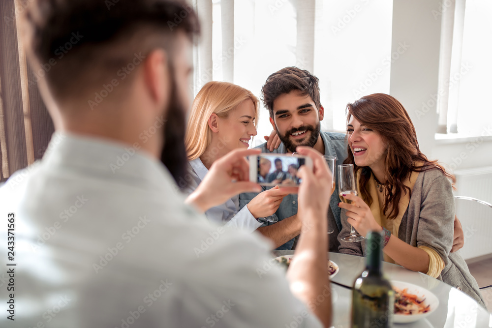 Portrait of a cheerful friends taking photo