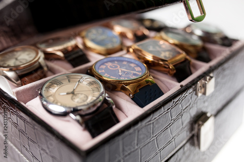 storage box with collection of men wrist watches