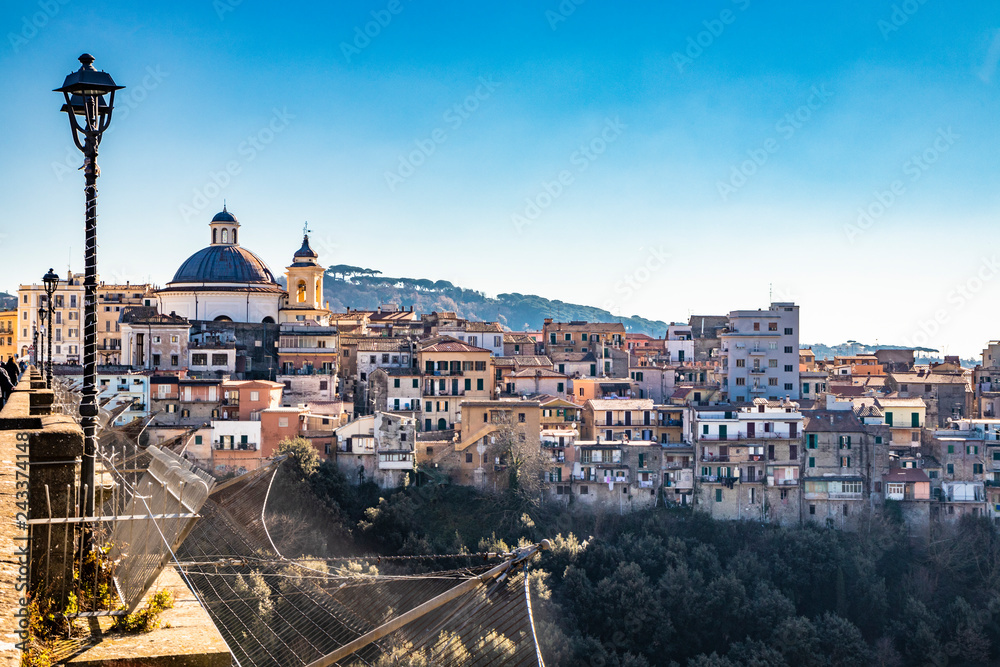 Obraz premium View of Ariccia, with the monumental bridge and the church of Santa Maria Assunta by Gian Lorenzo Bernini. Castelli Romani, Lazio, Italy.