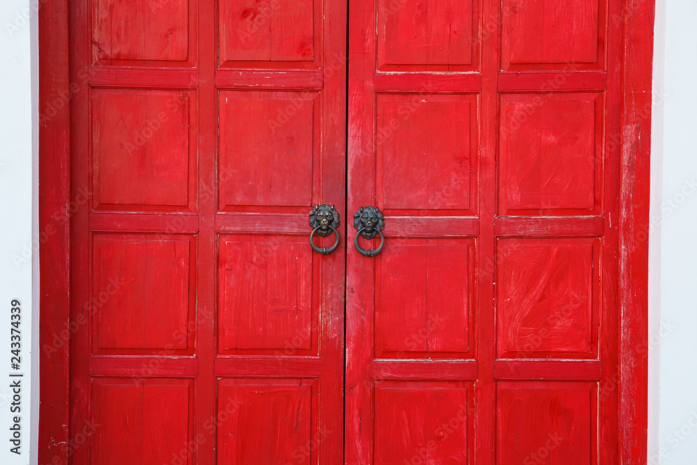Red vintage retro wooden door on white wall background. Home interior  architecture design, plain tropical textured wood panel board in old  traditional boutique Asian house, Wallpaper, backdrop concept Stock Photo |  Adobe