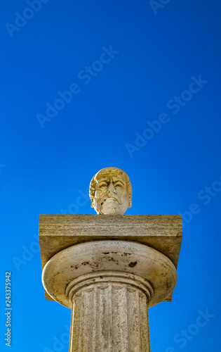 Travertine column with sculpture in memory of Giuseppe Mazzini, in the homonymous square with panoramic terrace. Ariccia, Castelli Romani, Lazio, Italy. photo