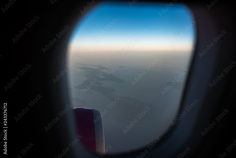 View from the window to airplane engine. Above the sky, on sunrise. View from the window to airplane engine. Above the sky, on sunrise.