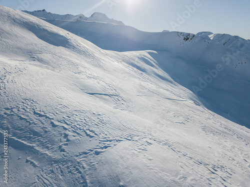 Aerial view of snow covered mountains in swiss alps