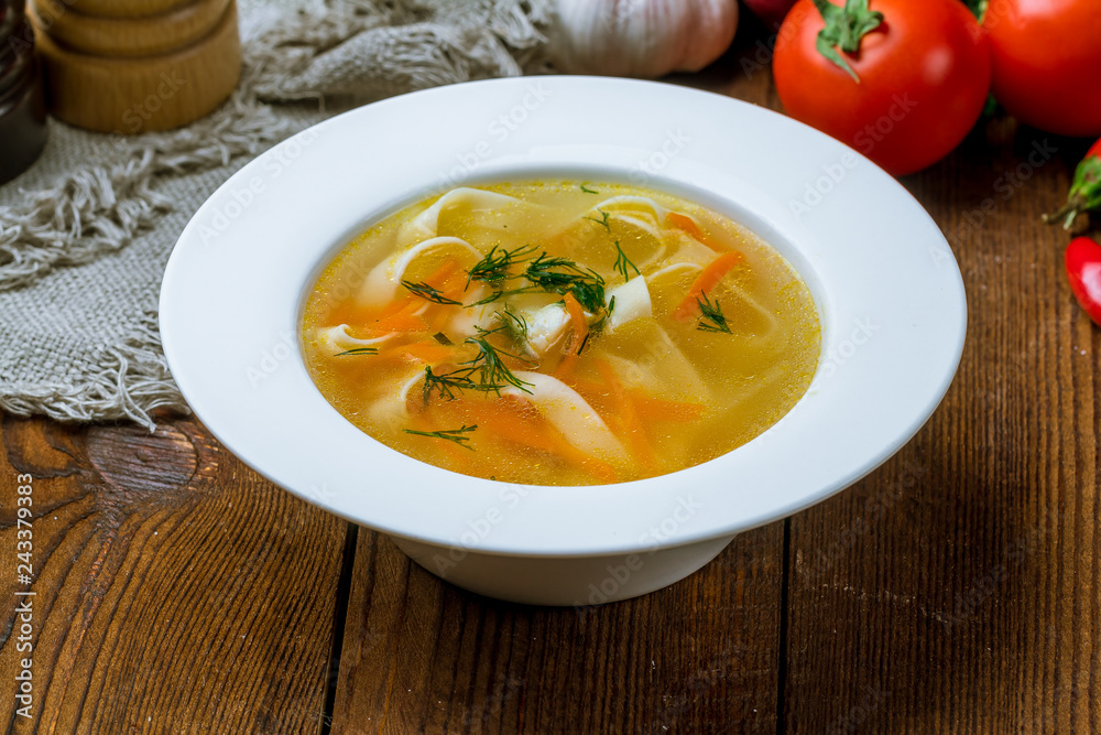 Chicken soup bouillon in a plate Chicken soup bouillon in a plate