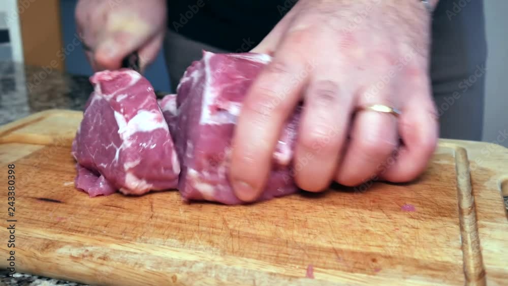 A man cuts the pork A man cuts the pork