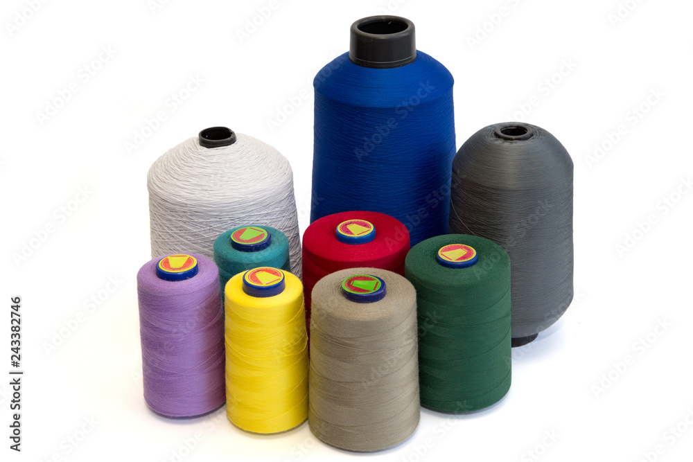 Spools Of Sewing Threads In Different Colors Isolated On White Background Spools Of Sewing Threads In Different Colors Isolated On White Background