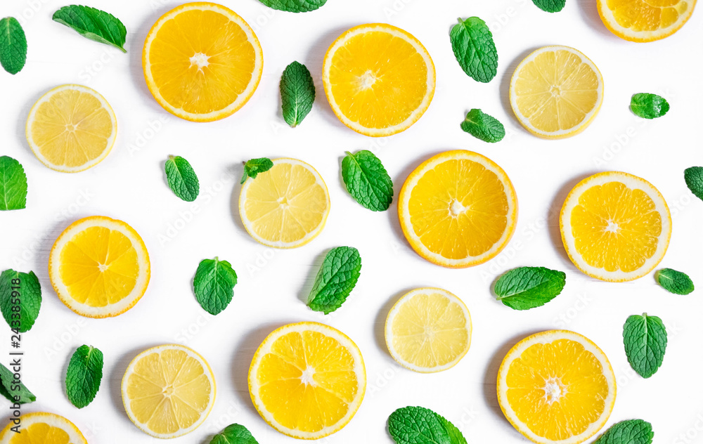 Orange and lemon slices with mint on a white background. Background for the design of banners, websites, blogs, information block. Frame for banner with orange and lemon. Pattern with fruit