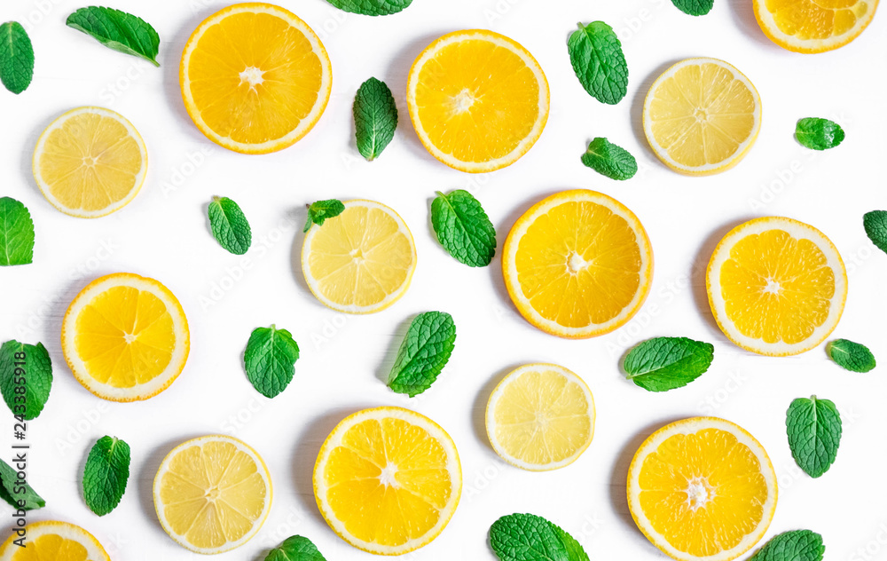 Orange and lemon slices with mint on a white background. Background for the design of banners, websites, blogs, information block. Frame for banner with orange and lemon. Pattern with fruit Orange and lemon slices with mint on a white background. Background for the design of banners, websites, blogs, information block. Frame for banner with orange and lemon. Pattern with fruit